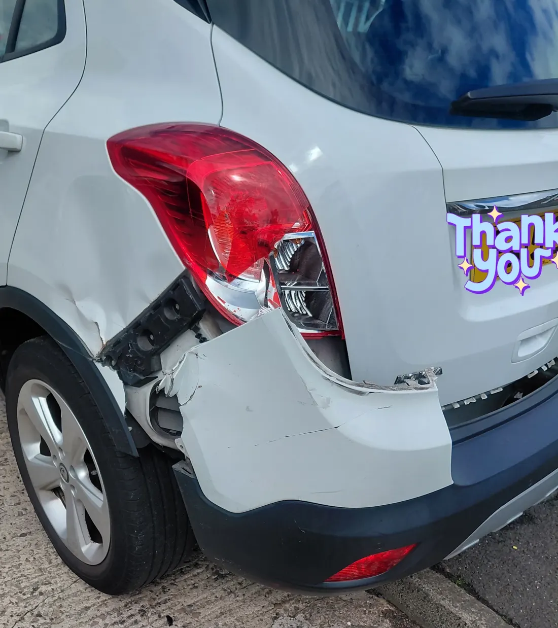 Before: white SUV rear bumper and quarter panel accident damage